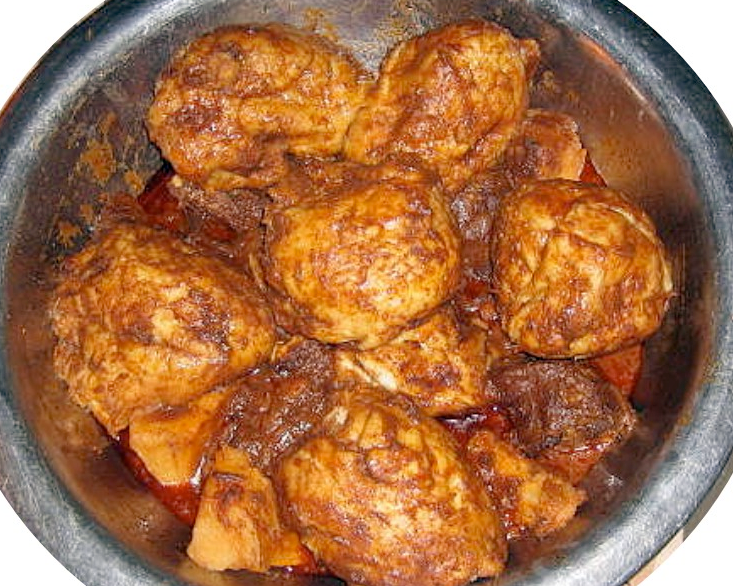 tukasu, mutton stew with dumplings piled in a black bowl