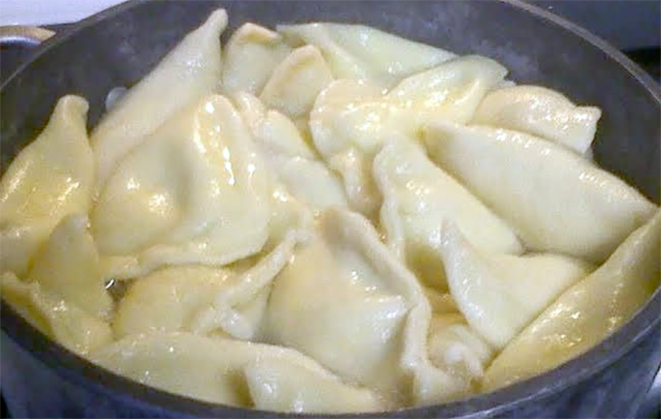 pierogi drained in their boiling pan