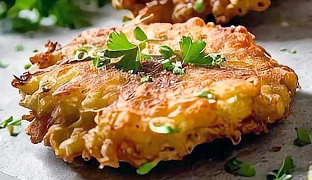 white fish fritter on a blue plate